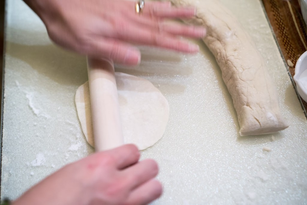 Re-rolling cold-water dough, with plenty of additional flour (don't worry if the dough looks like it's cracking! As long as it doesn't crack when you roll it, you're fine.)