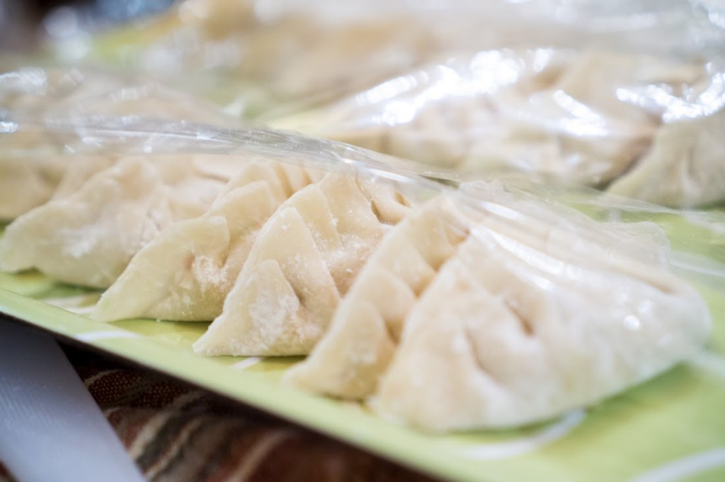 A lovely tray of finished dumplings made from packaged dumpling wrappers.