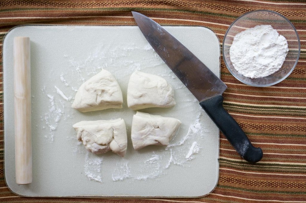 Cut the dough into four even chunks (pictured is the hot-water dough).