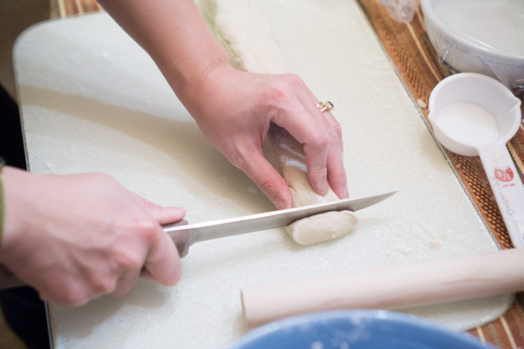 Frantically cutting re-rolled cold-water dough