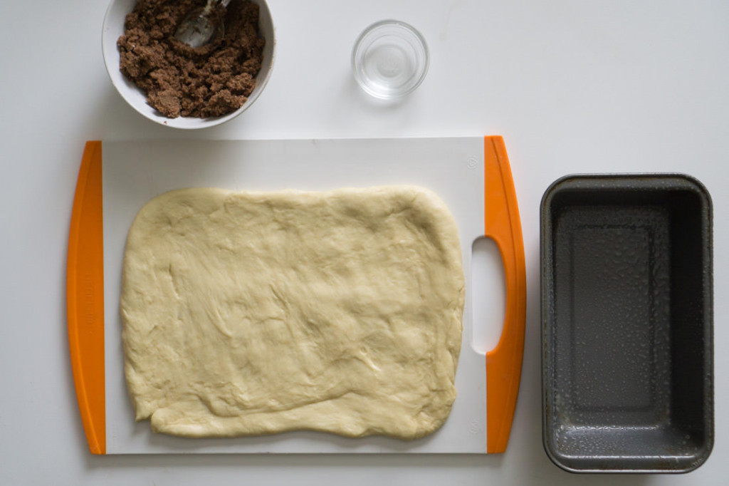 Japanese milk bread after first rise, rolled out and ready for the cinnamon sugar topping