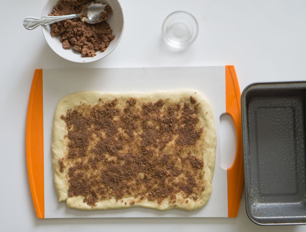 Japanese milk bread dough, patted out and topped with cinnamon-sugar topping